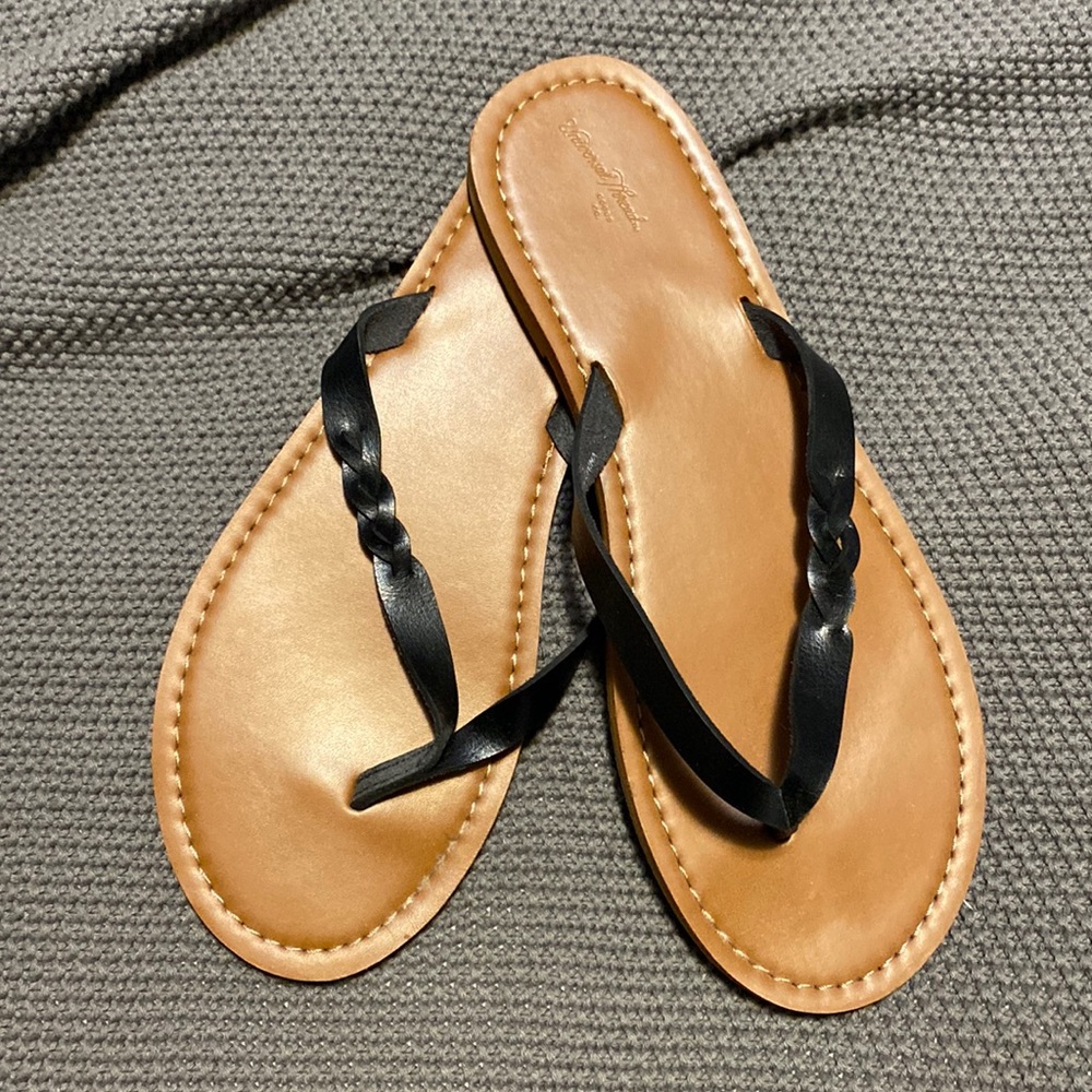 Black and brown flip flops